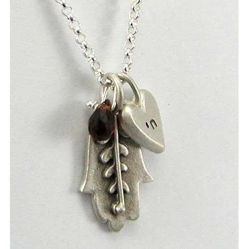 Emily Rosenfeld Hamsa Necklace with Chai Heart Charm and Dangling Garnet