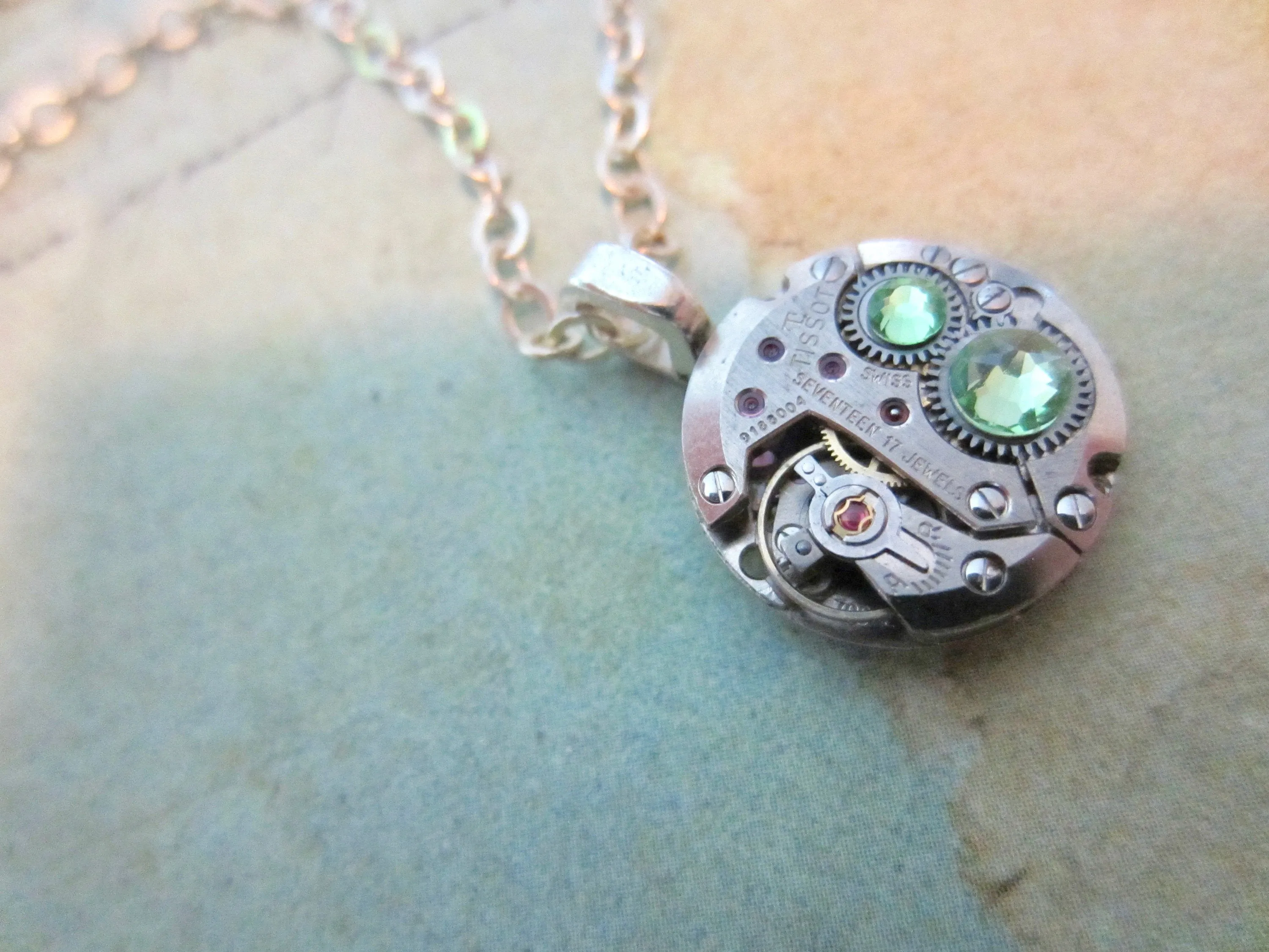 Watch part necklace - Bullet Proof - Steampunk Necklace - Repurposed Art Peridot Swarovski crystals.